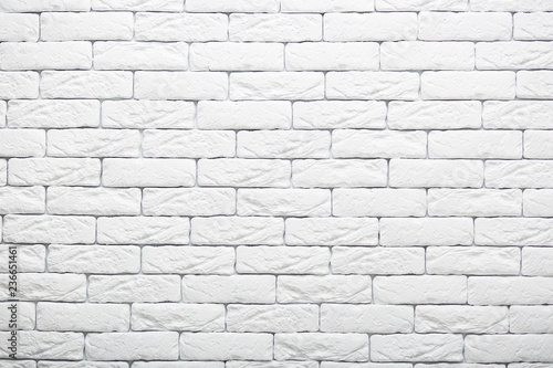 White brick wall texture for your background. Rural room. Abstract shot. Vintage structure. Whiten facade. Copy space for your advertsiement
