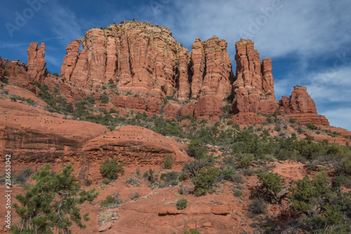 Towering red rock formations create a dramatic landscape against the sky in Sedona, Arizona