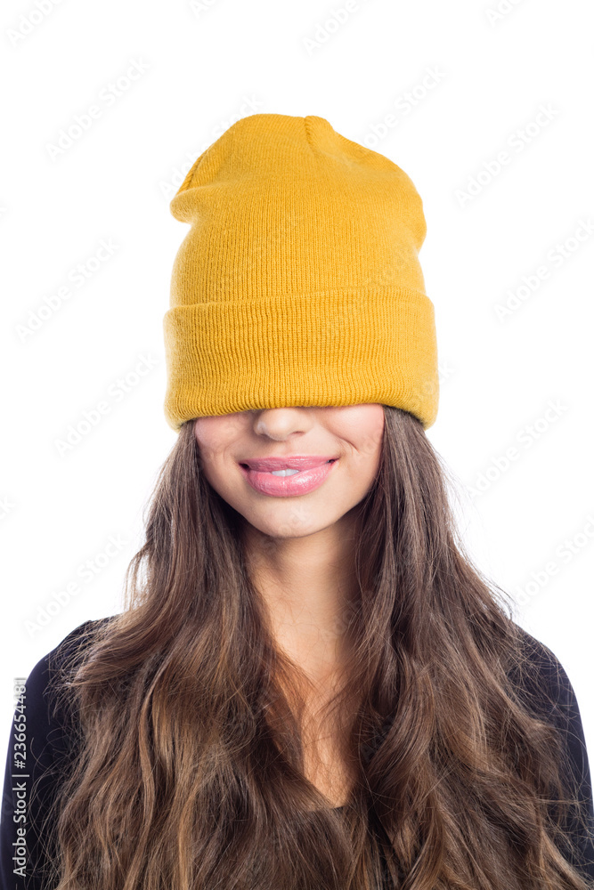 Happy long hair young woman in yellow beanie hat Happy long hair young woman in yellow beanie hat