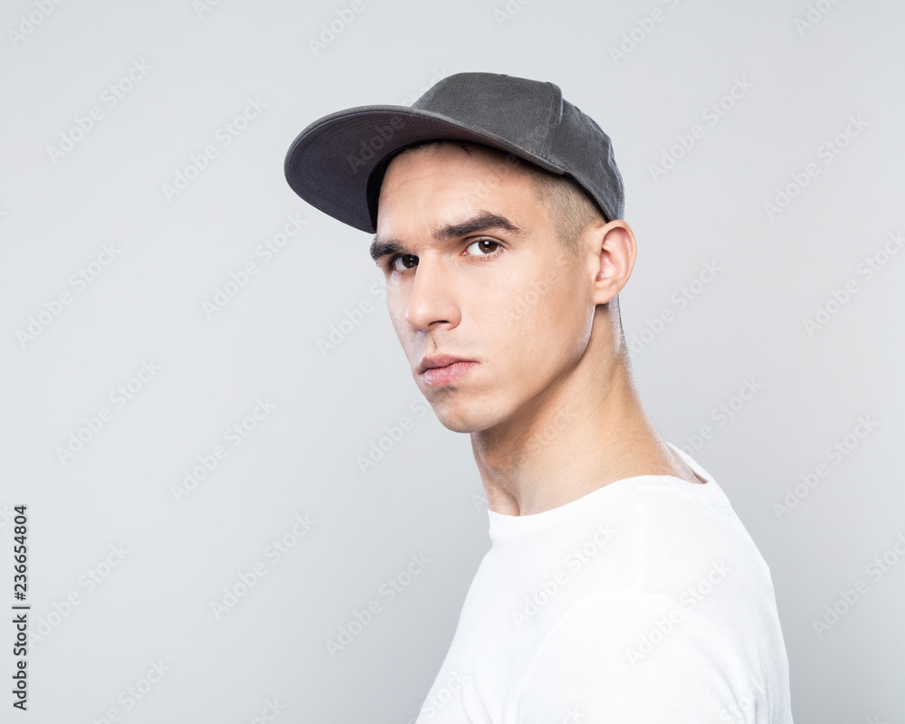 Portrait of confident young man in baseball cap