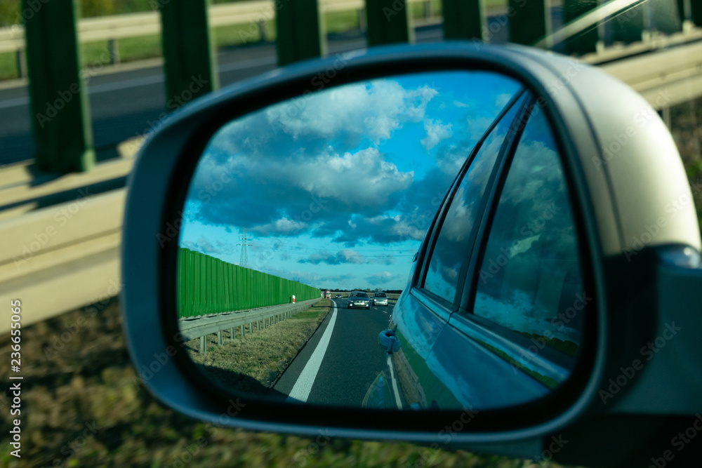 road in the rearview mirror