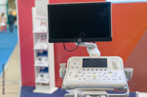 Blur of equipment and medical devices in modern operating room take with art lighting and blue filter. Medical equipment blurred