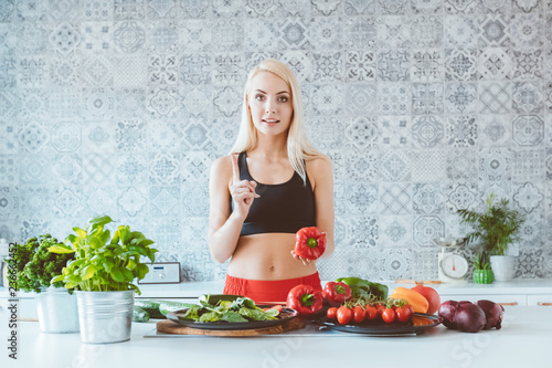 Young woman preparing vegetable in the kitchen photo