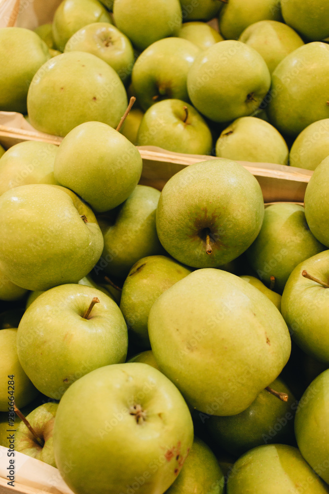 Pile of fresh ripe green apples in boxes at market Pile of fresh ripe green apples in boxes at market