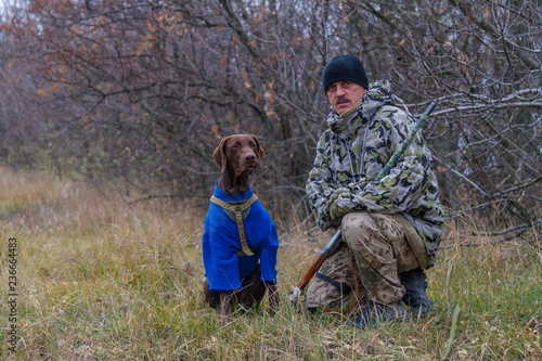 hunter with a dog named Argo gun for