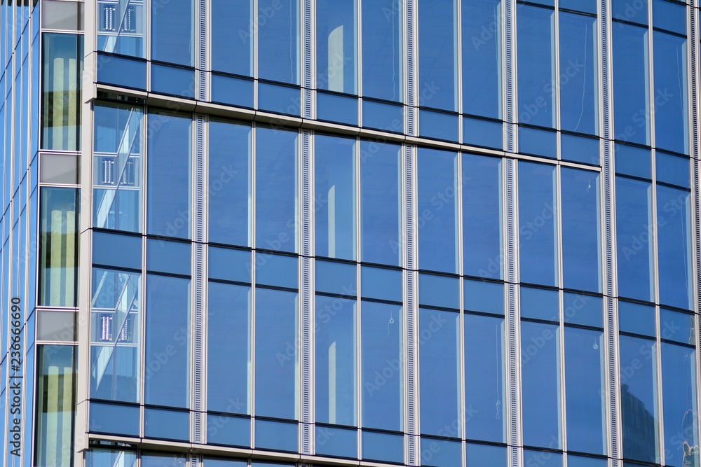 View of modern glass skyscraper,exterior of glass wall with abstract texture View of modern glass skyscraper,exterior of glass wall with abstract texture
