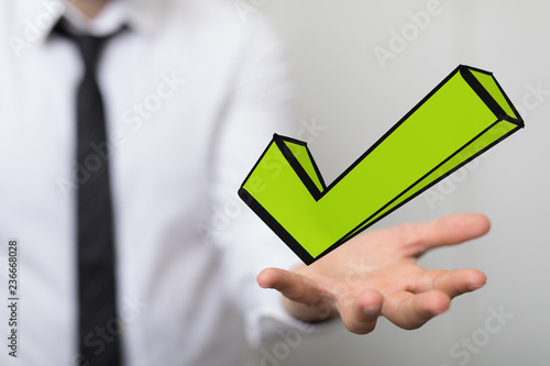 green checkmark in hand