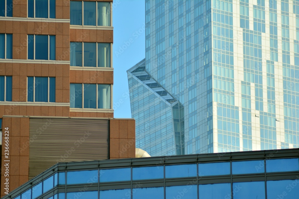 Obraz premium View of modern glass skyscraper,exterior of glass wall with abstract texture