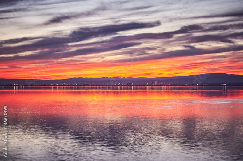 Sunset in the calm waters of the Albufera de Valencia, Spain.