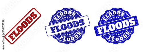 FLOODS grunge stamp seals in red and blue colors. Vector FLOODS watermarks with grunge texture. Graphic elements are rounded rectangles, rosettes, circles and text captions.
