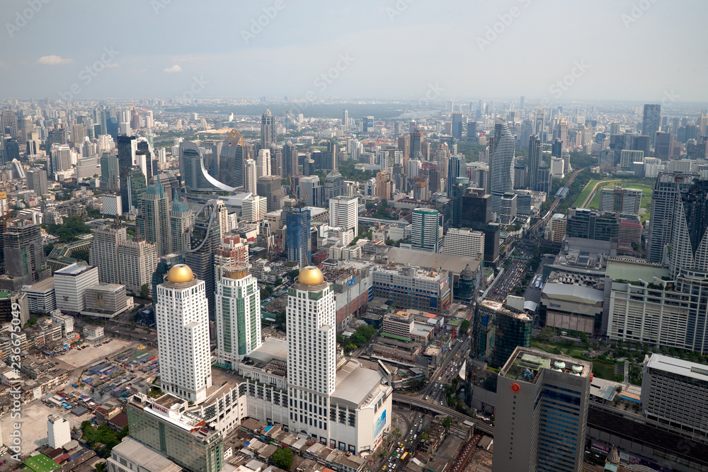 Fototapeta premium BANKGKOK, THAILAND - MAY 10 2018: Aerial view on the city from Bayok Sky hotel in sunny day