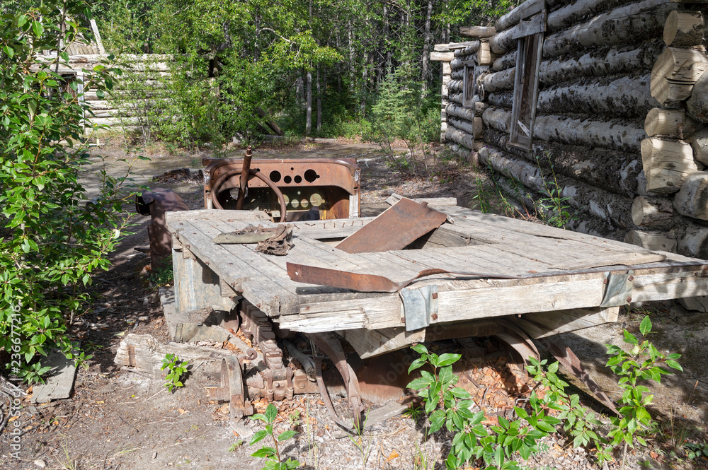 Abandoned truck with wood flatbed in Silver City ghost town, Yukon Territory, Canada Abandoned truck with wood flatbed in Silver City ghost town, Yukon Territory, Canada
