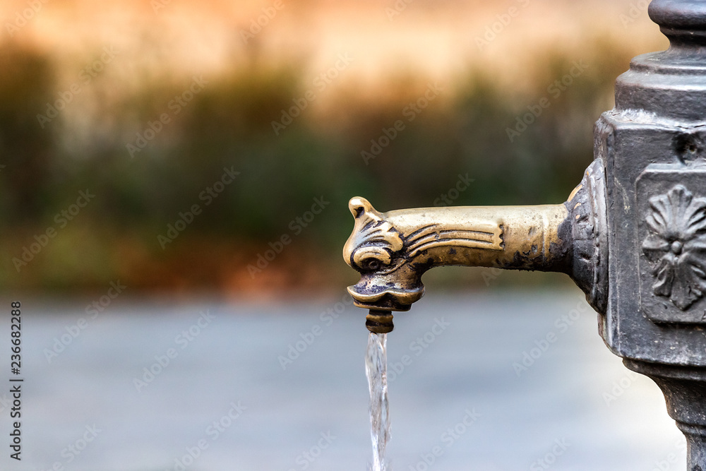Closeup of a vintage faucet - drinking fountain in Venice, Italy.