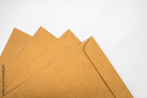 A brown envelope on a wooden floor surface, space for copy.