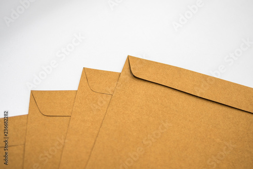 A brown envelope on a wooden floor surface, space for copy.
