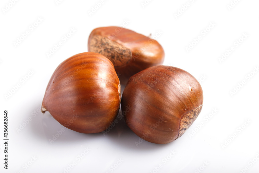  sweet chestnuts isolated on white background