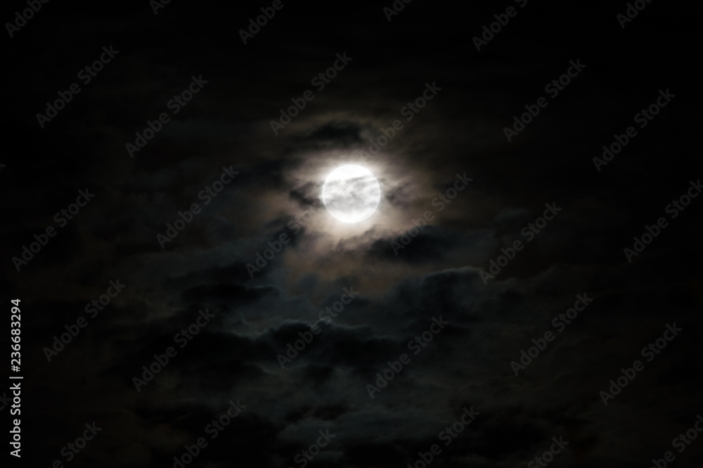 Full moon on a cloudy night.
