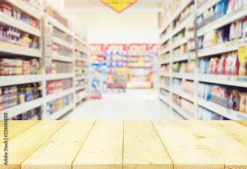 Supermarket or retail store blur background. That is a self-service shop offer grocery and variety of food, beverage and household product on shelf or rack. For shopping background or product display. © DifferR
