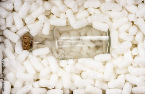 Fragile bottle in foam pellets