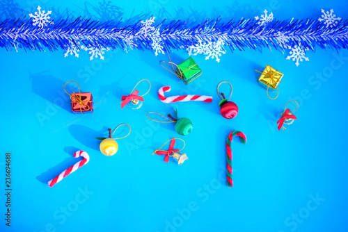Top view christmas composition red, yellow and green gifts, Decorations on blue background.