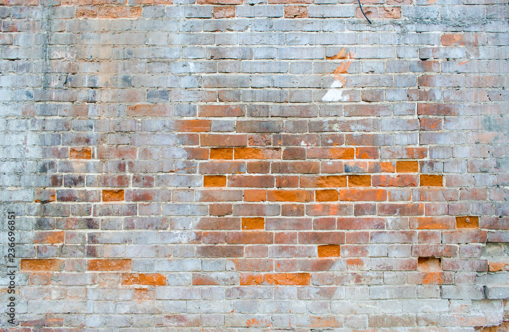 Naklejka premium Old brick wall with white paint. Background image