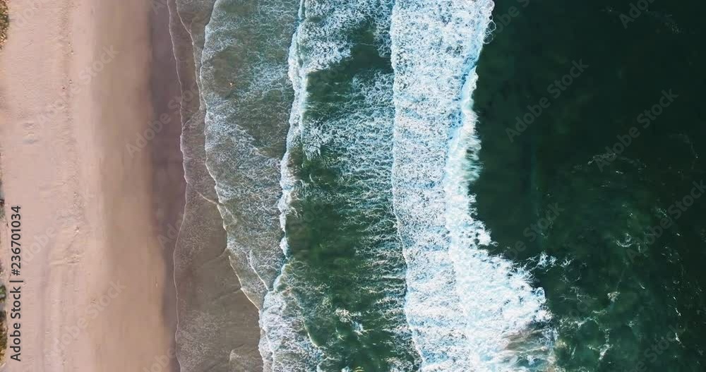 Aerial Drone Shot Top Down View of Ocean Waves Rolling onto the Beach Aerial Drone Shot Top Down View of Ocean Waves Rolling onto the Beach