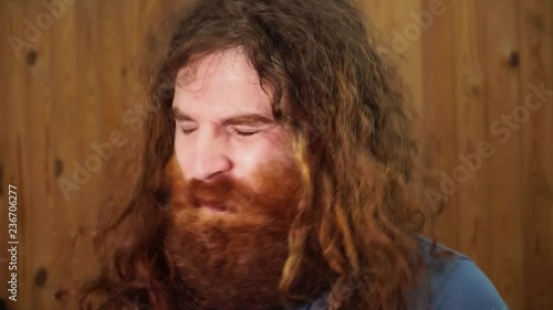 Long haired bearded man crazy  insane close up