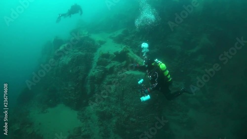 Wallpaper Mural Scuba diver cameramen with group swimming deep underwater in Lake Baikal. Torontodigital.ca