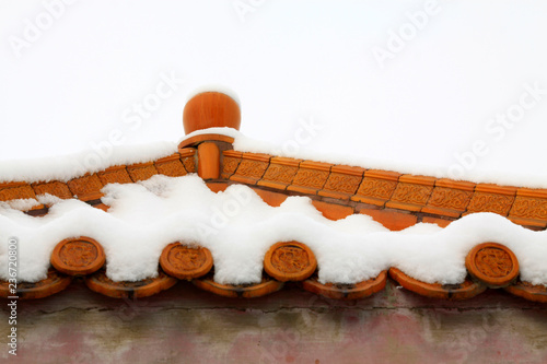 Chinese traditional glazed tile and snow