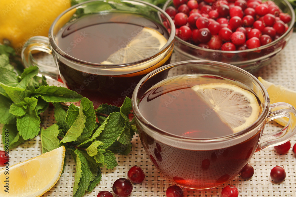 Hot tea with lemons, mint and cranberry Hot tea with lemons, mint and cranberry