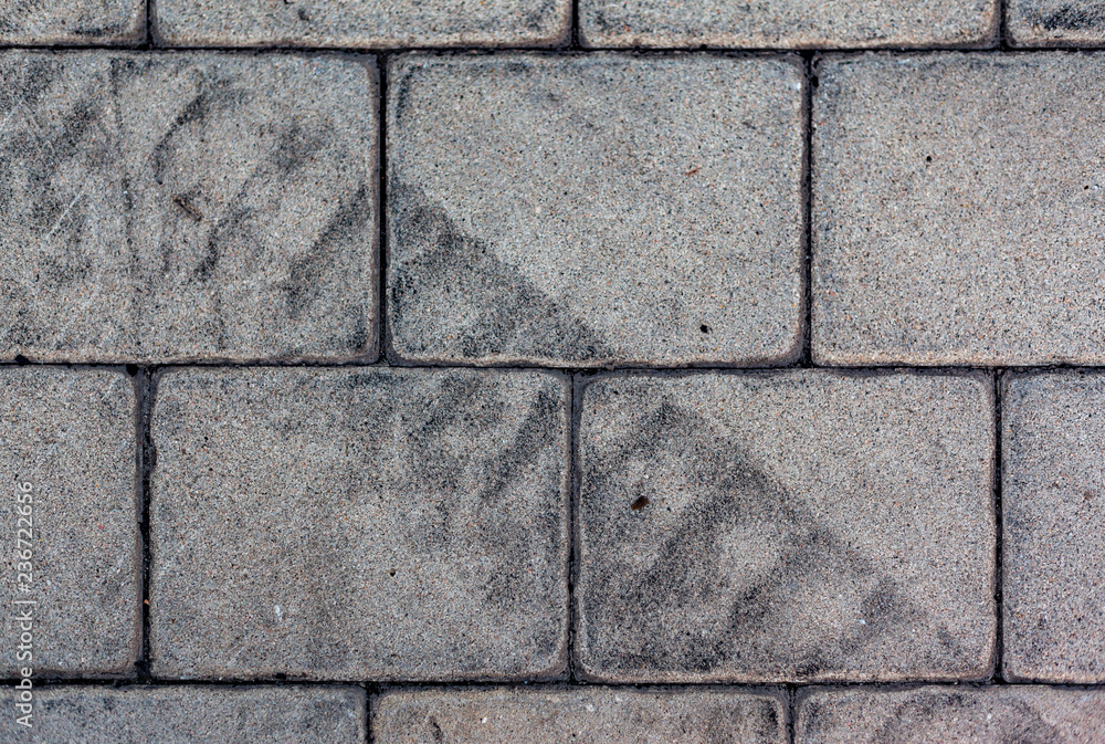 Car tire tread imprint on the paving slab Car tire tread imprint on the paving slab