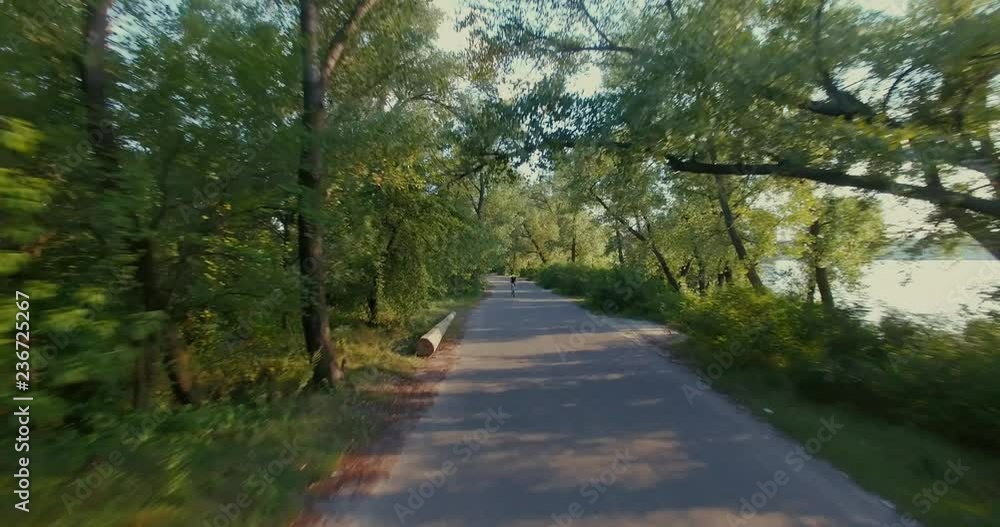 Cycling Aerial. Cyclist From Drone. MTB Cyclist Aerial View.Man Ride Bike On Rural Road.Healthy man cycling MTB bicycle outdoors fitness.