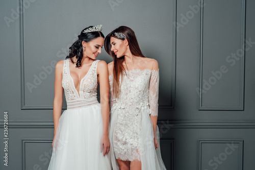 Smiling ladies in white dresses