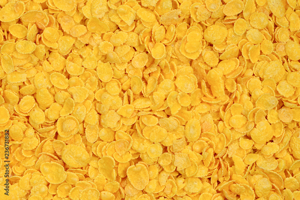 Corn-flakes background and texture. Top view. cornflake cereal box for morning breakfast. Corn-flakes background and texture. Top view. cornflake cereal box for morning breakfast.