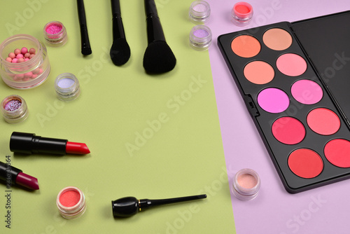 Professional makeup products with cosmetic beauty products, blushes, eye liner, eye lashes, brushes and tools.