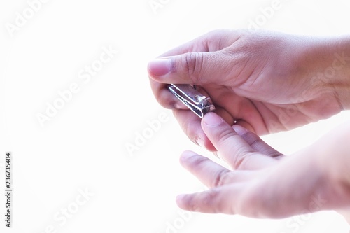 Closeup women cut fingernai