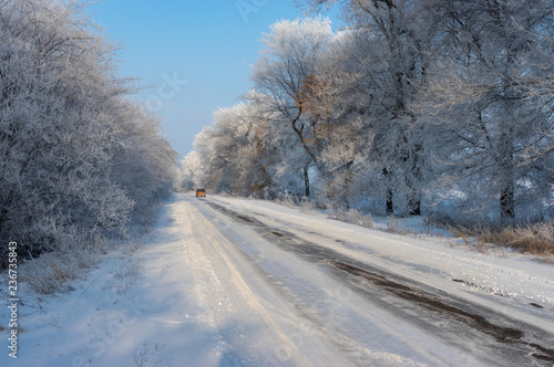 Winter landscape with slippery country road in Ukraine © Yuri Kravchenko