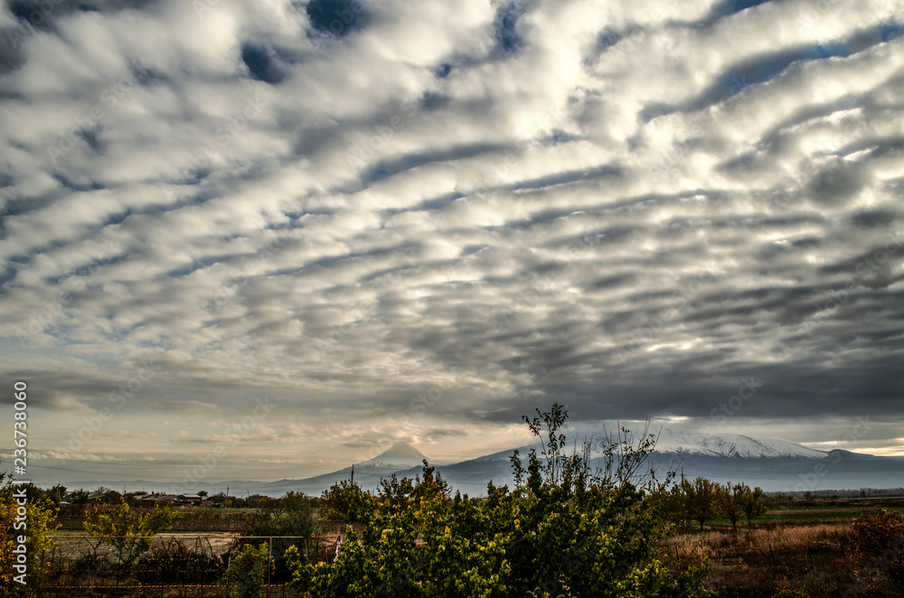 Autumn sky in the valley of mount Ararat darkened from the accumulated layered-cumulus clouds
Autumn sky in the valley of mount Ararat darkened from the accumulated layered-cumulus clouds
