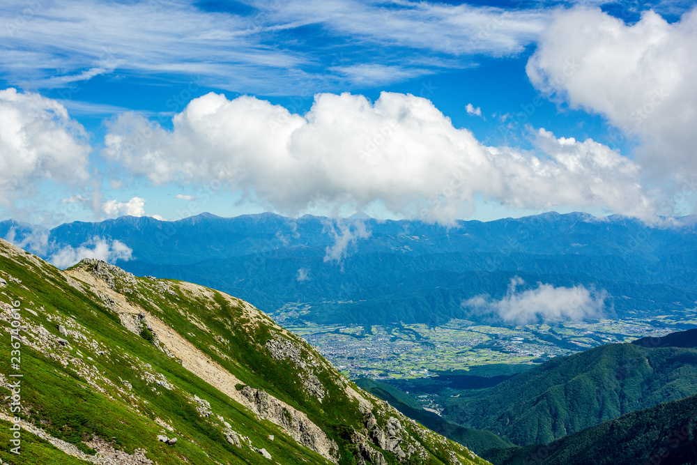 View of city from top of mountain in Central Alps, Nagano Prefecture, Japan.