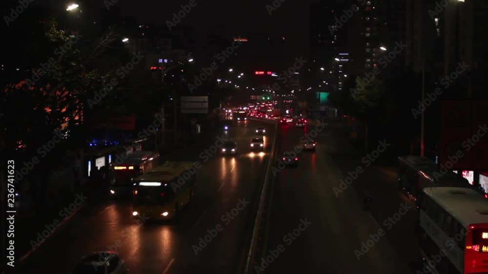 Shekou, Nanshan district Shenzhen, Guangdong province, China; cars and vehicles moving slowly at streets at night; Shekou, Nanshan district Shenzhen, Guangdong province, China; cars and vehicles moving slowly at streets at night;