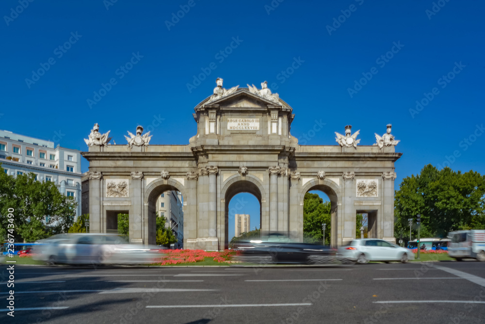 Puerta de Alcala, famous spanish monument, on a sunny day. Madrid, Spain.