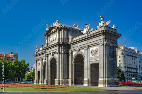 Puerta de Alcala, famous spanish monument, on a sunny day. Madrid, Spain.