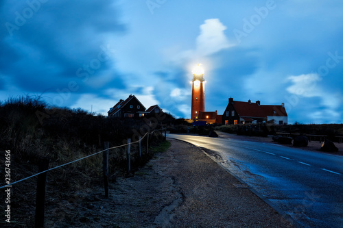 road to red lighthouse in night