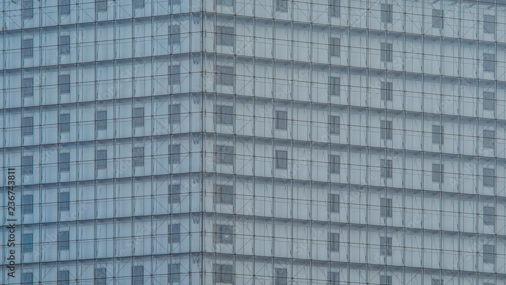 Clear transparent glass wall facade background. Multi-layer curtain wall. The windows behind the glass wall Clear transparent glass wall facade background. Multi-layer curtain wall. The windows behind the glass wall