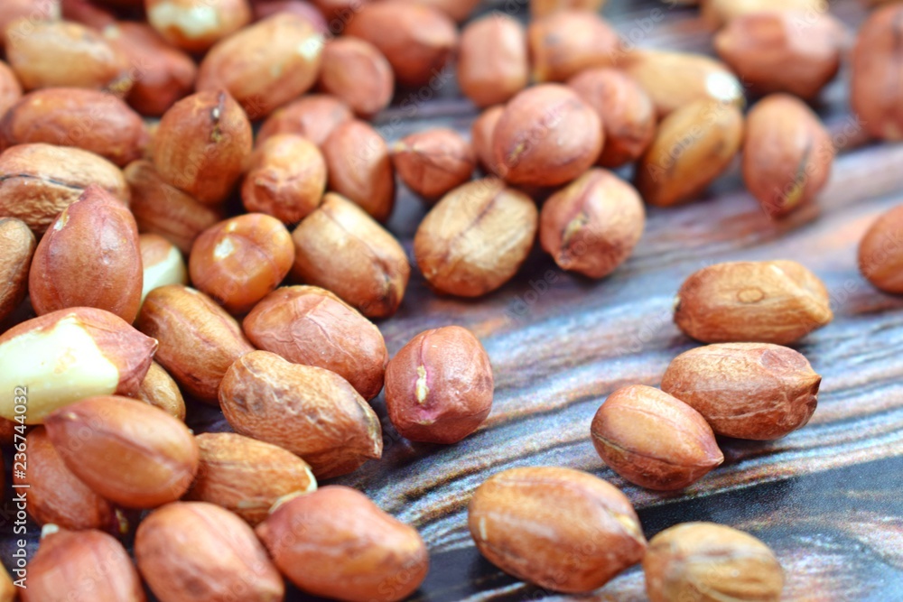 Peanuts on wooden background.Healthy. Peanuts on wooden background.Healthy.