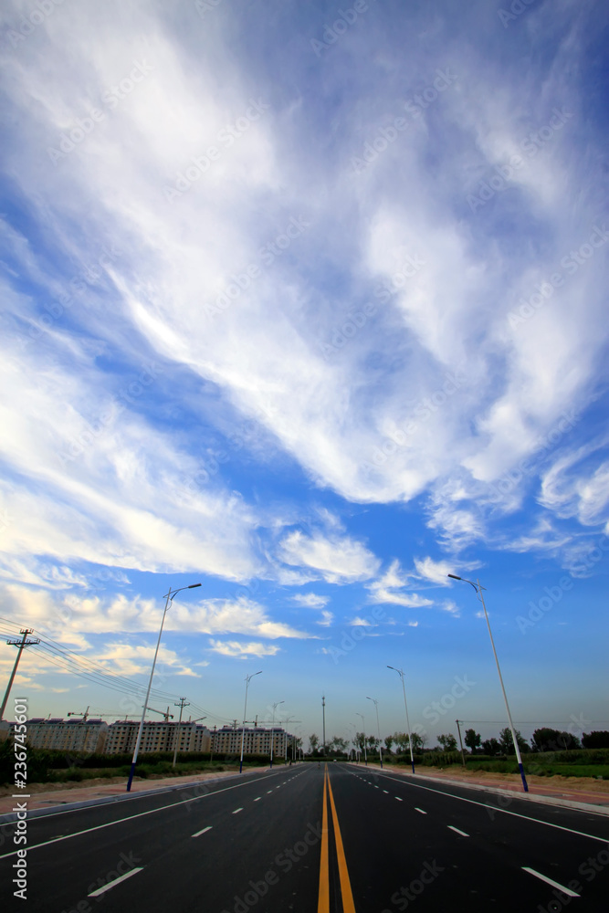 new roads under blue sky and white clouds new roads under blue sky and white clouds