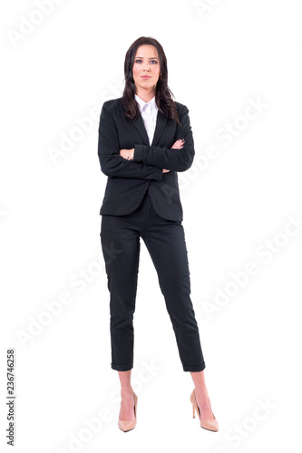 Serious bossy woman business manager with crossed arms looking at camera intense. Full body isolated on white background. 