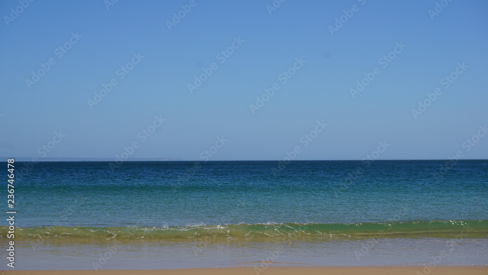 sea with blue sky and clouds