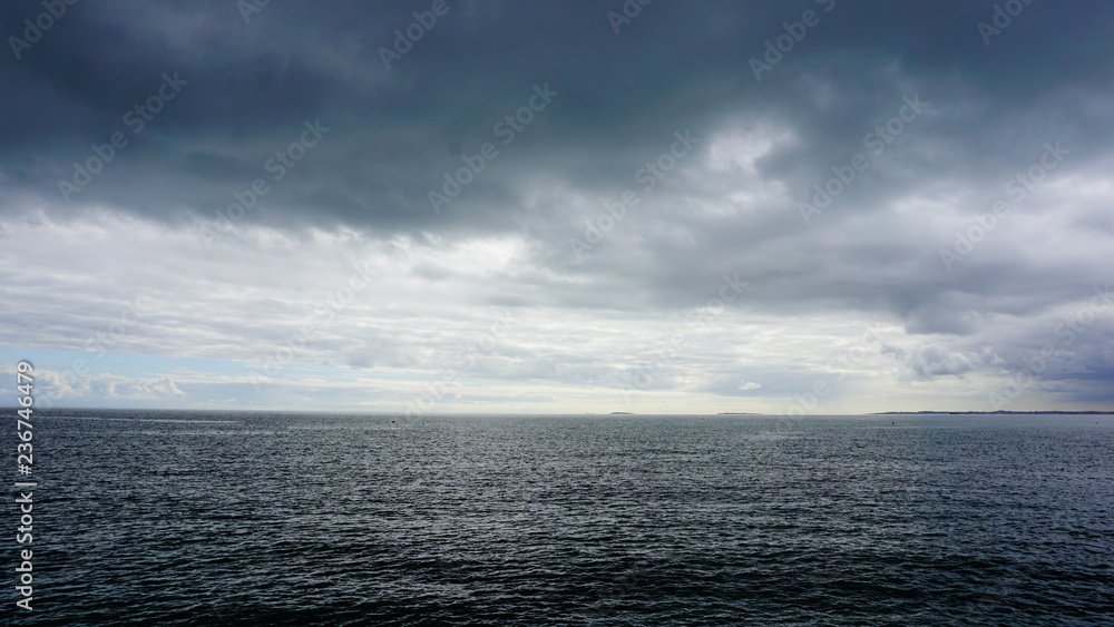 sea with blue sky and clouds