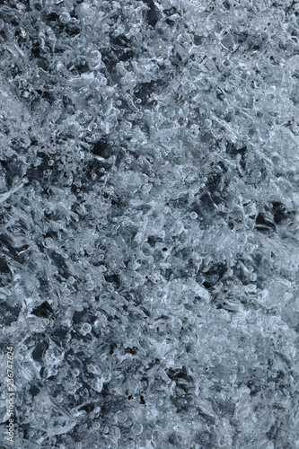 Details and bubbles on the ice of a glacier